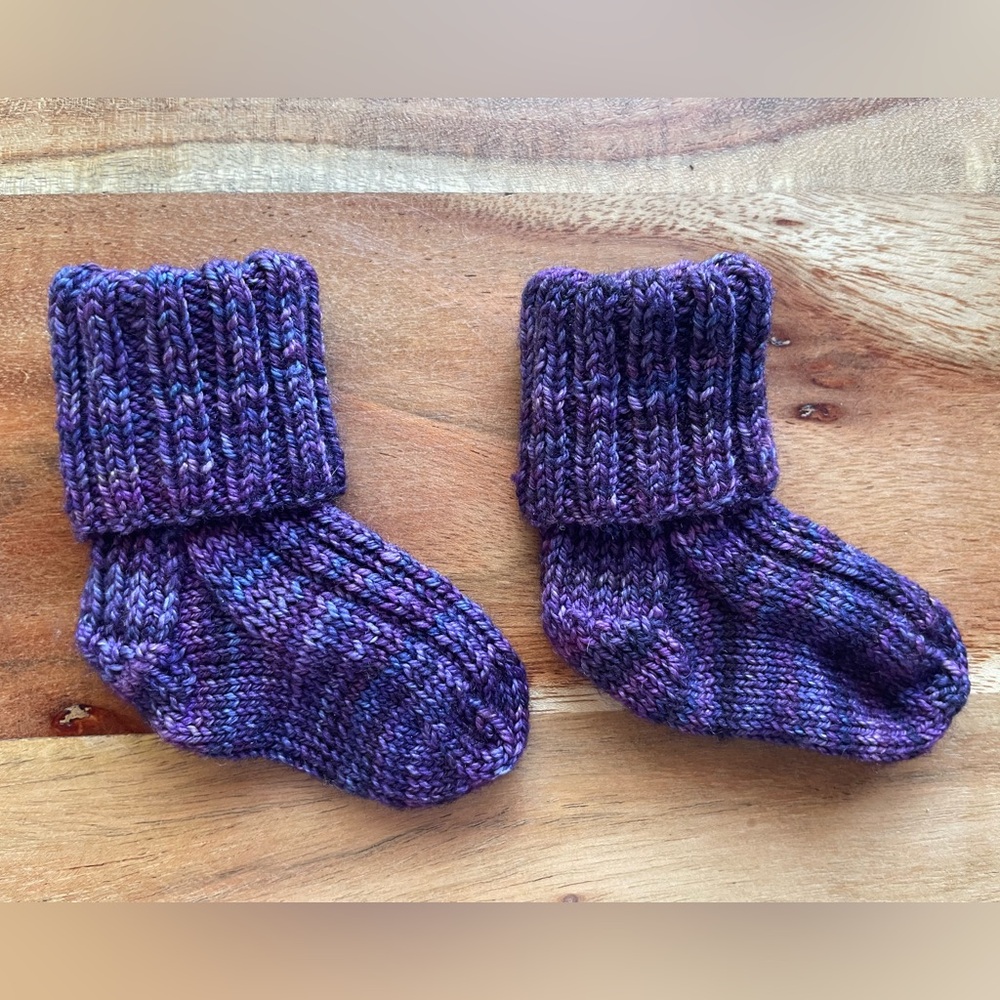 Last chance! Hand Knit Baby Socks—that will actually stay on your baby’s feet!